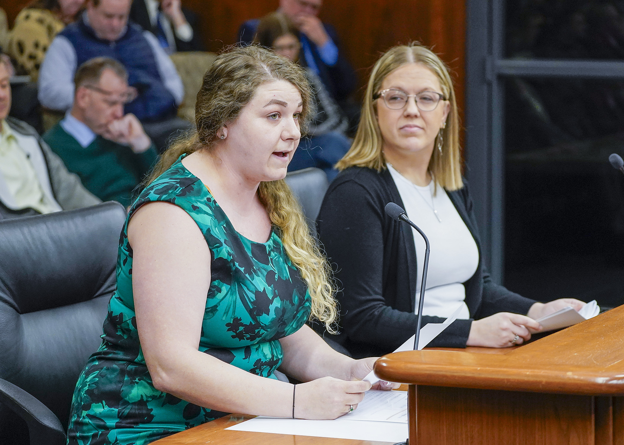 Kayla Fearing testifies before the House commerce committee in support of a bill sponsored by Rep. Jessica Hanson, right, to authorize patients enrolled in a registry program to cultivate up to 16 cannabis plants without a license. (Photo by Andrew VonBank)